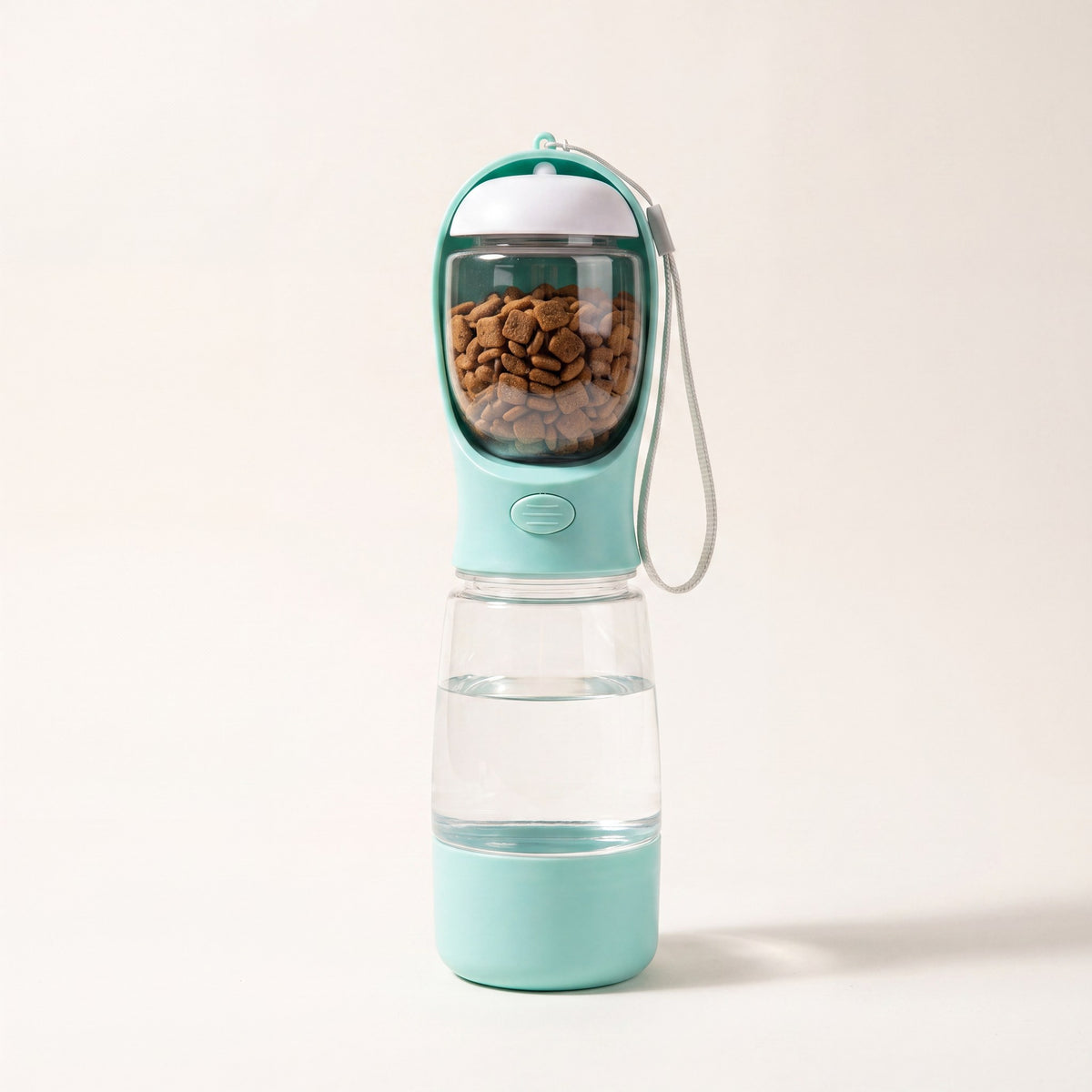 Trail Companion dog water bottle shown with carry strap, 20.3 oz water tank and 3.5 oz food container
