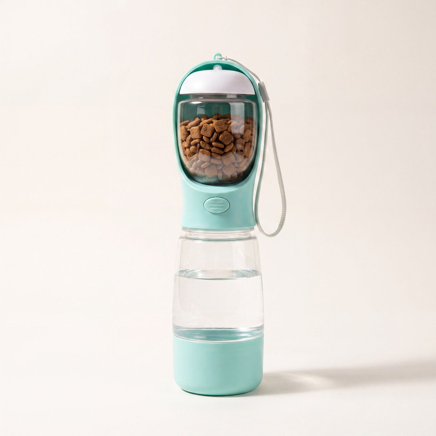 Trail Companion dog water bottle shown with carry strap, 20.3 oz water tank and 3.5 oz food container