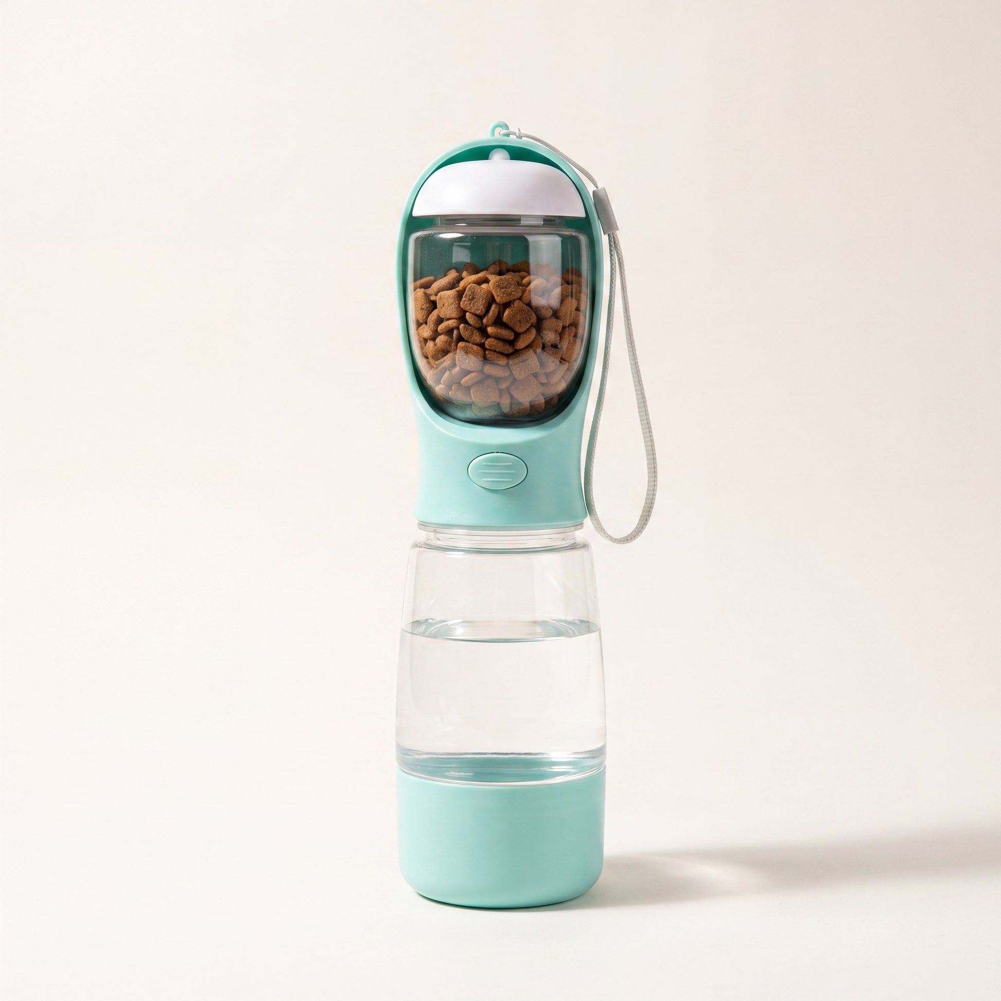 Trail Companion dog water bottle shown with carry strap, 20.3 oz water tank and 3.5 oz food container